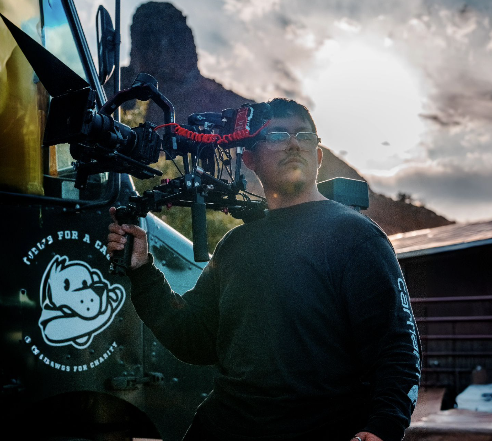 Photographer holding camera rig outdoors